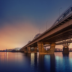 Railway bridge in Kiev at night. Ukraine.