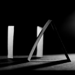 Dark paper shapes and shadows with dark paper background