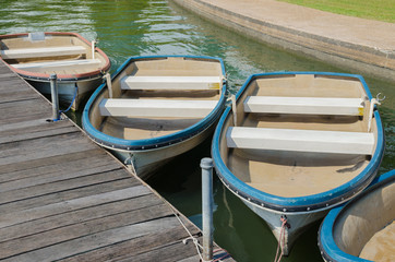 Fototapeta na wymiar Little Boats Float Parking In The Lake of Public Park.