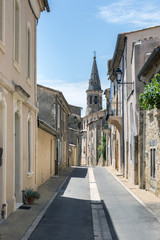Narrow street in city center of Saint-Saturnin-les-Apt, a small