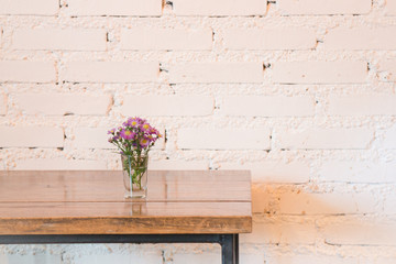 Room interior white brick wall with wooden table