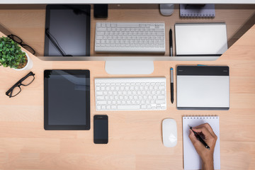 Top view office hand working write paper note