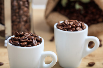 Cups with coffee beans