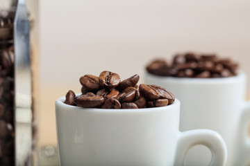 Cups with coffee beans