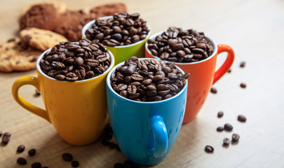 Cups full of coffee beans