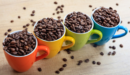Cups full of coffee beans