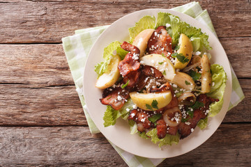 Swedish salad with fried bacon, green apple and goat cheese. Horizontal top view
