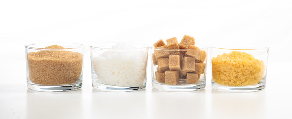 Various types of sugar on white background