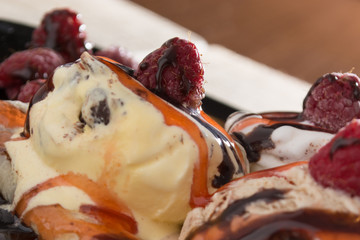 Fresh, golden pancakes with fruit and cream