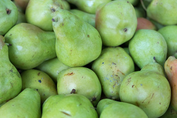 Green pears for sale at city market