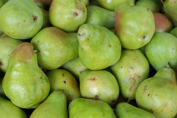 Green pears for sale at city market
