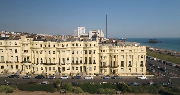 Aerial view of a regency square in Brighton and Hove with the town and the beach in the background