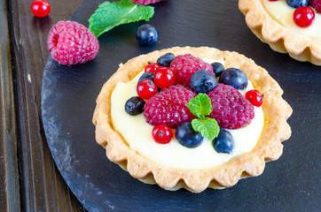 tartlets with custard and berries