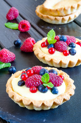 tartlets with custard and berries