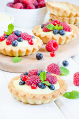 tartlets with custard and berries