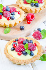 tartlets with custard and berries