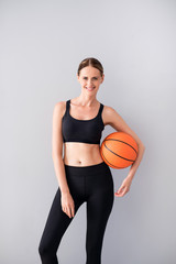 Nice young woman holding ball