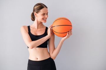 Nice young woman with ball