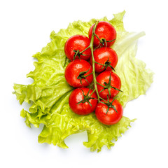Plum tomatoes with leaves on white background