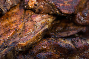 baked pork steak on bbq grill close-up