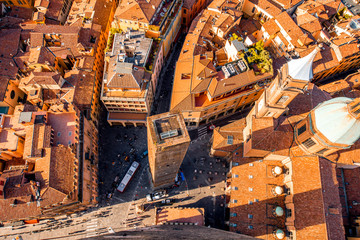 Aerial cityscape view from the tower on Bologna old town with Garisenda tower and roman catholic church © rh2010