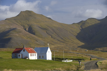 Fototapeta na wymiar An Icelandic farmhouse and church on the Snaefellsnes Peninsula in SW Iceland.