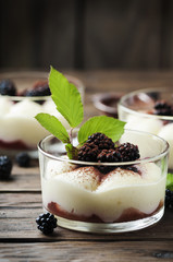 Homemade dessert with blackberry and cream