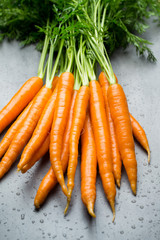 Fresh carrots on the gray backgrounds.