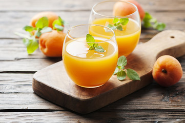 Healthy apricot juice with mint on the wooden table