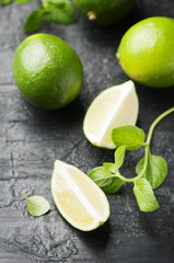 Fresh lime and mint on the black table