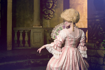 Victorian lady. Young woman in eighteenth century image posing in vintage exterior © Alex Shadrin