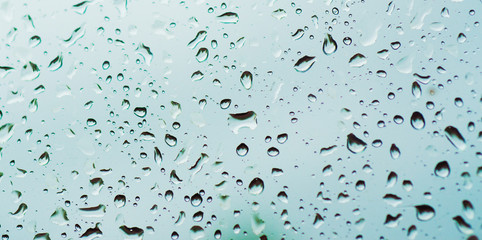 Rainy wet cold blue sky eco seasonal natural abstract background with water drops