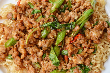 instant noodle topping spicy stir fried minced pork and basil leaf on dish