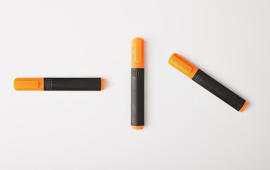 ballpoint pens of different colors on a white background