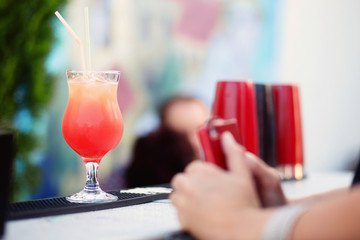Bartender preparing cocktail for guests