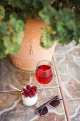 healthy breakfast : yogurt, glass of juice and fresh raspberries