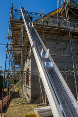LOUTH, ENGLAND - AUGUST 26: Bumpa tile hoist/lift on a house build project. In Louth, Lincolnshire, England. On 26th August 2016.