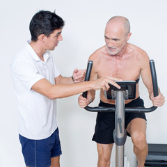 Personal trainer helping with heart rate test