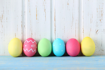 Easter eggs on a blue wooden table