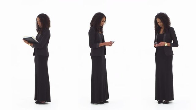 African American Woman using notepad, tablet and cellphone