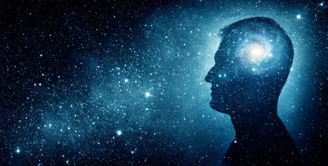 The universe within. Silhouette of a man inside the universe. The concept on scientific and...