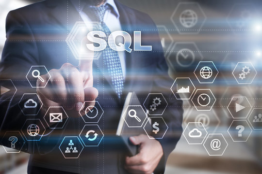 Businessman is pressing on the virtual screen and selecting "SQL".