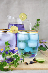 Glass of Butterfly Pea Juice on Wooden Board