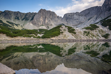 Anazing view of roks around  Sinanitsa Peak and reflection in the lake, Pirin Mountain, Bulgaria