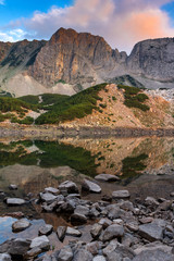 Sunset with colored in red clouds of Sinanitsa peak and  the lake, Pirin Mountain, Bulgaria