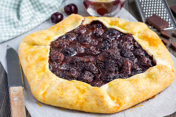 Cottage cheese dough galette with cherries and chocolate, horizontal