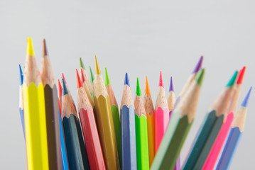 Colors pencils, colorful many crayons on white background.