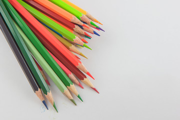 Colors pencils, colorful many crayons on white background.