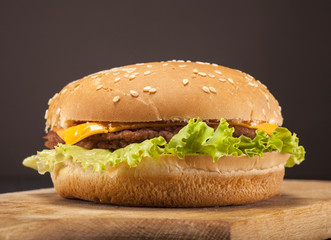 Fresh burger on brown background