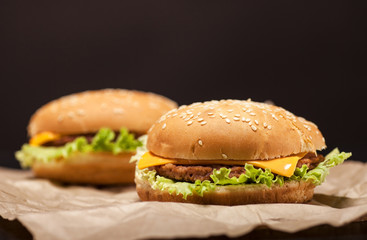Fresh burgers on brown background